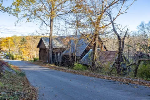 a view of a house with a tree