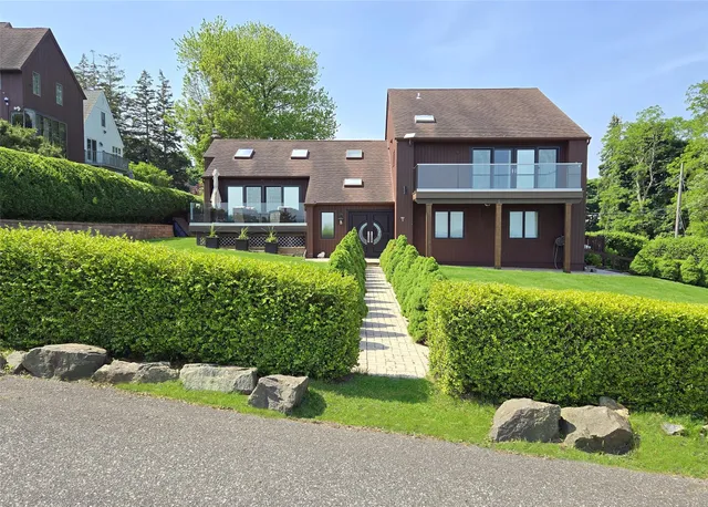 front view of a house with a yard