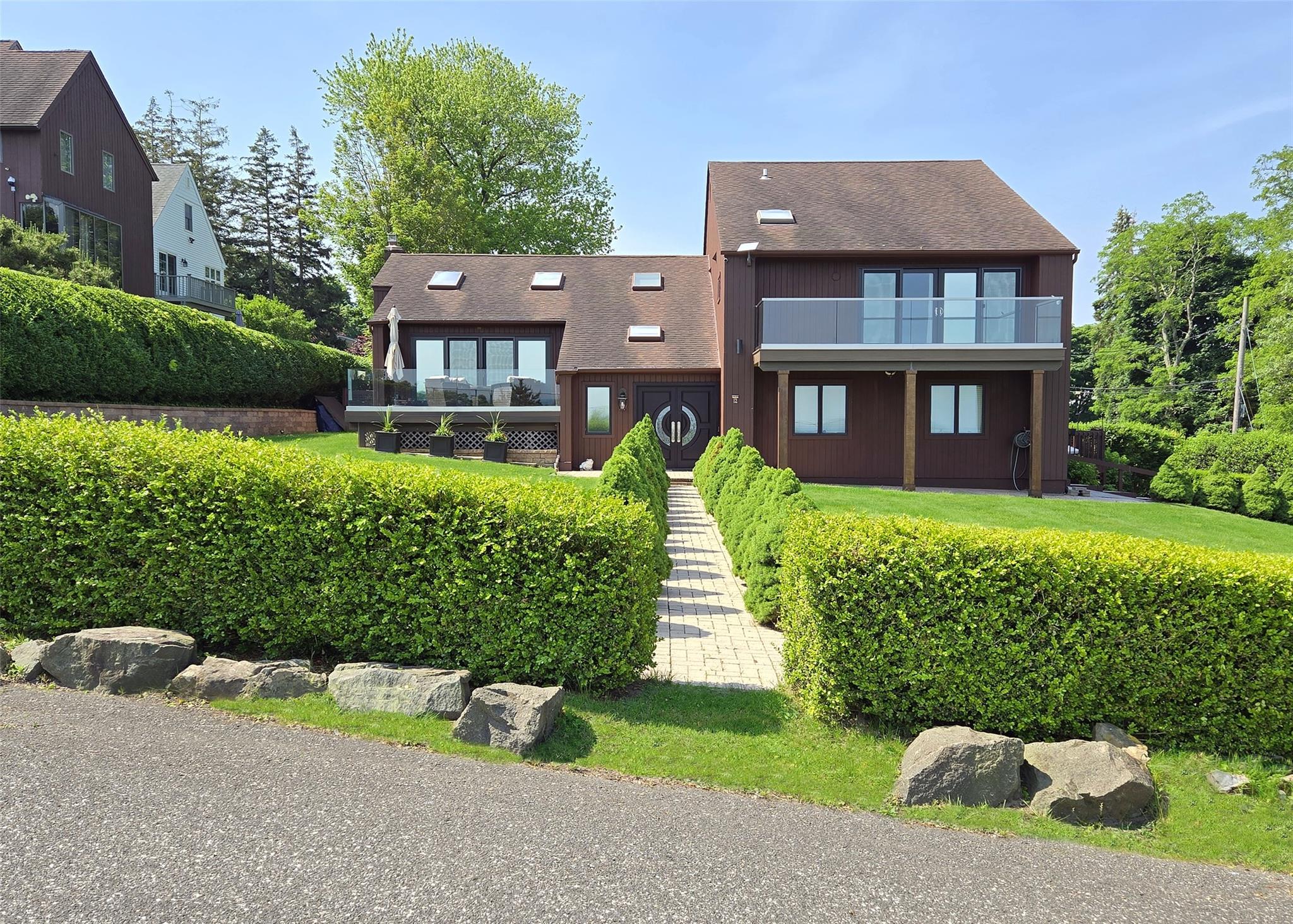 front view of a house with a yard