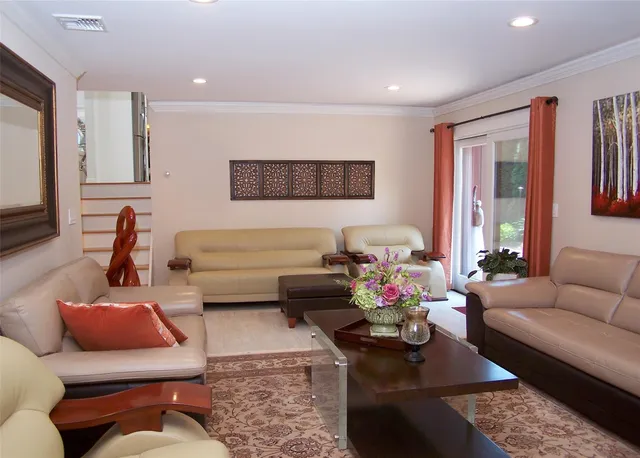 a living room with furniture or couch and a flat screen tv