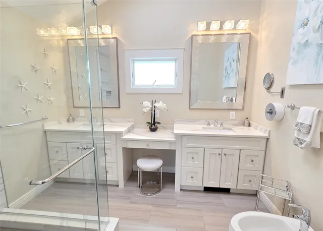 a bathroom with a sink double vanity and a mirror