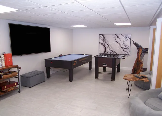 a room with furniture and a flat screen tv