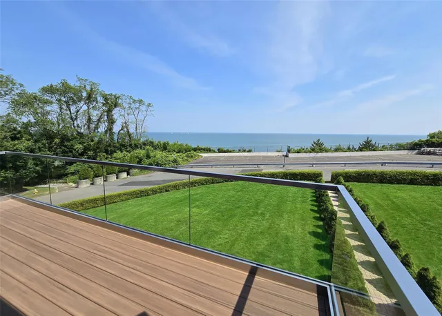 a view of a yard with a wooden fence