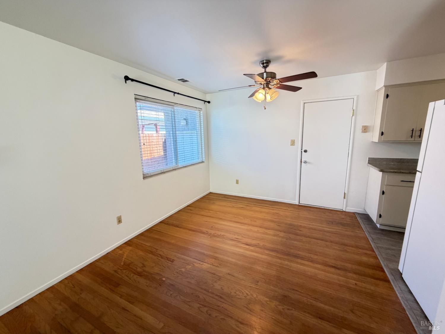 991 Rolling Green Drive Rio Vista, CA 94571 - Photo 11 of 30 wooden floor in an empty room with a window