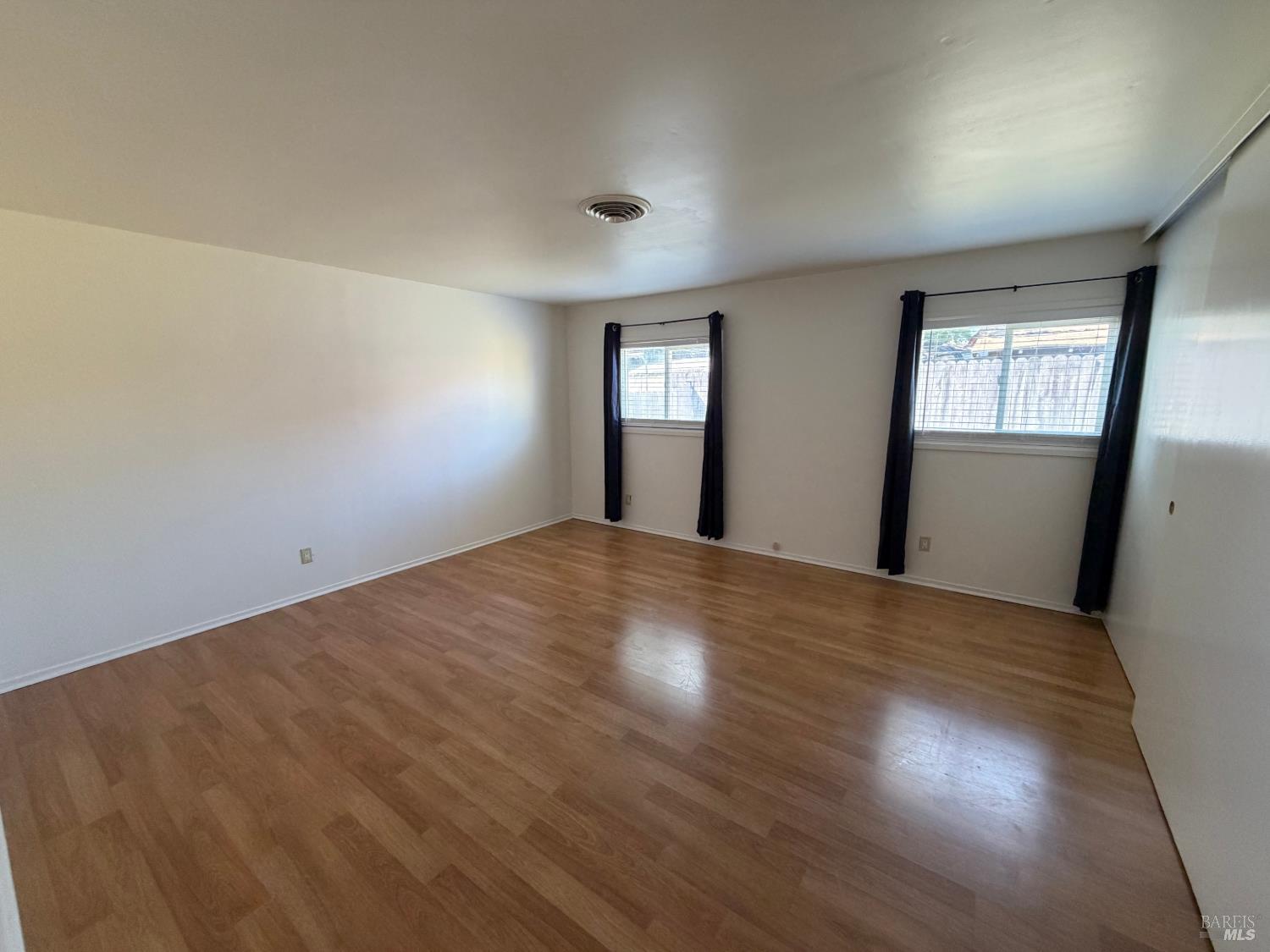 991 Rolling Green Drive Rio Vista, CA 94571 - Photo 21 of 30 a view of empty room with wooden floor and fan