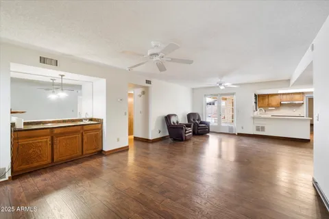 a view of living room with furniture and fireplace