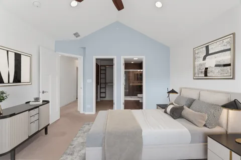 a bedroom with a bed and walk in closet