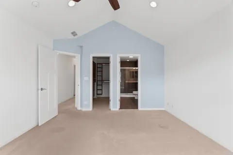 a view of empty room with furniture