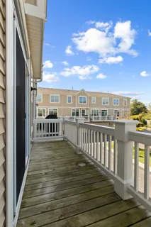 a view of a balcony with wooden floor