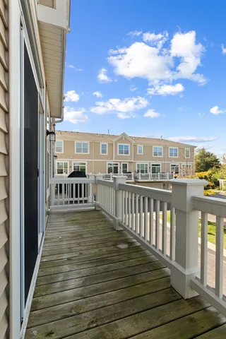 a view of a balcony with wooden floor