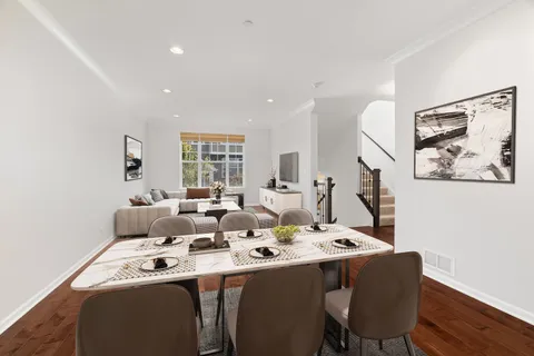 a dining room with furniture and window