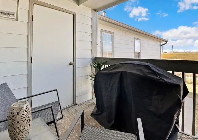 a view of balcony with furniture