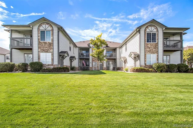 a front view of house with yard and swimming pool