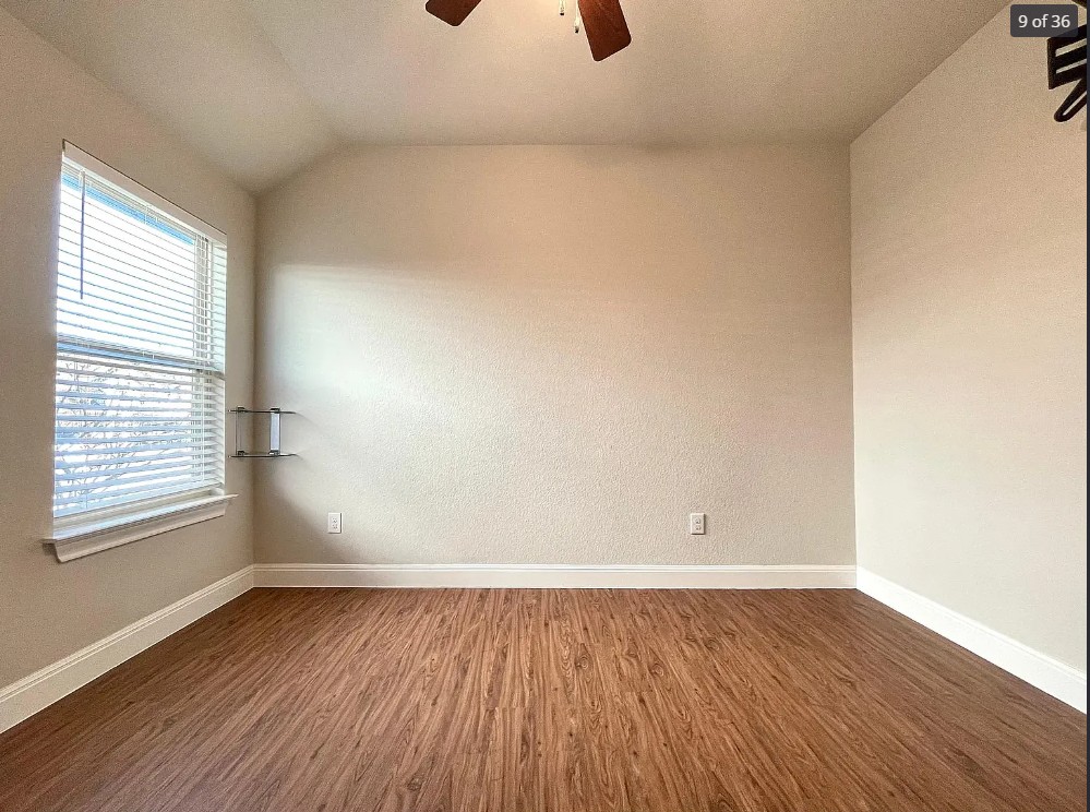 205 Jude Circle Leander, TX 78641 - Photo 12 of 36 an empty room with wooden floor and windows