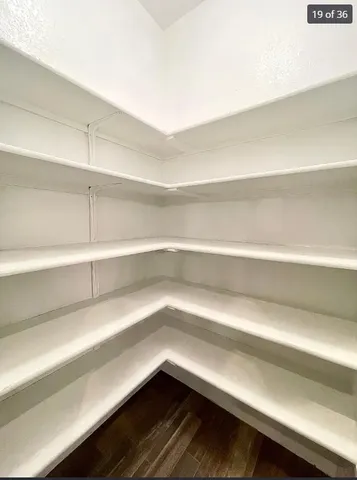 a view of a kitchen with a sink and a microwave