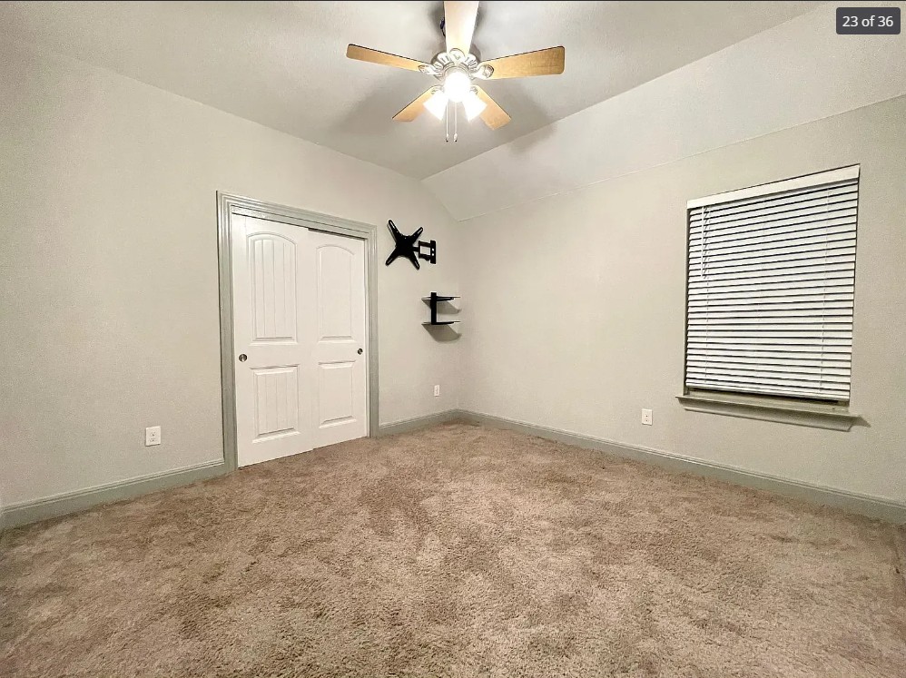 205 Jude Circle Leander, TX 78641 - Photo 21 of 36 an empty room with a ceiling fan and a window