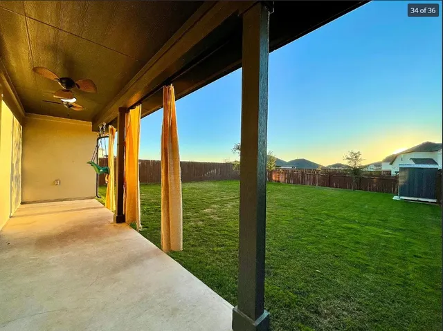 a view of a porch with a big yard