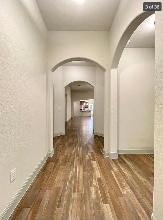 205 Jude Circle Leander, TX 78641 - Photo 6 of 36 a view of a hallway view with wooden floor and staircase
