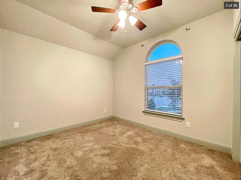 205 Jude Circle Leander, TX 78641 - Photo 8 of 36 en empty room with windows and ceiling fan