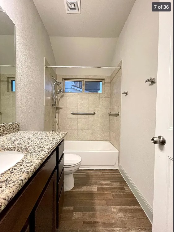 205 Jude Circle Leander, TX 78641 - Photo 10 of 36 a bathroom with a granite countertop sink toilet and shower