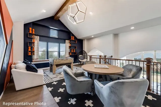 a living room with furniture a window and kitchen view