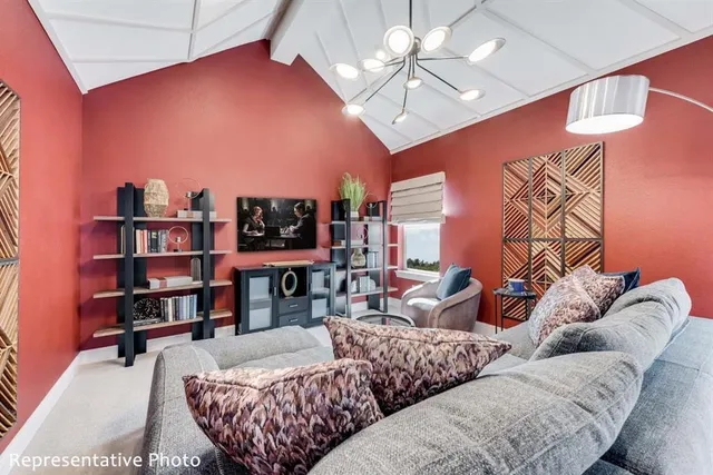 a living room with furniture or couch and a bookshelf