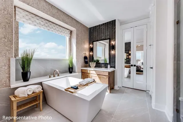 a room with sink and mirror