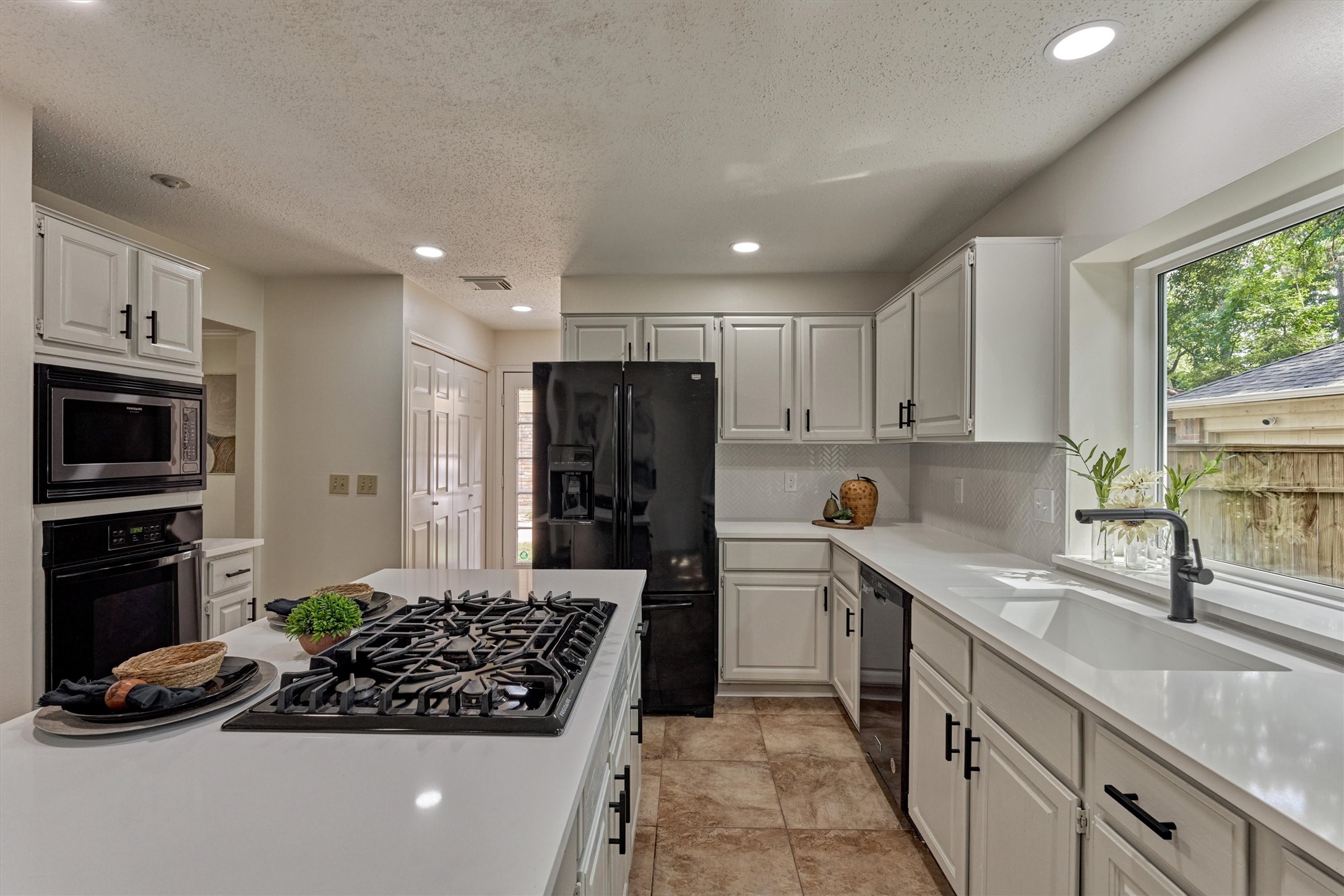 71 Breezy Point Place Spring, TX 77381 - Photo 17 of 40 Gas cooktop and abundant counter space for creating meals that will satisfy them all.
