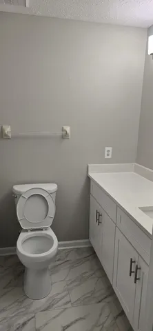 a bathroom with a sink a mirror a bathtub and shower