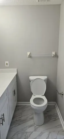 a bathroom with a shower and a bath tub