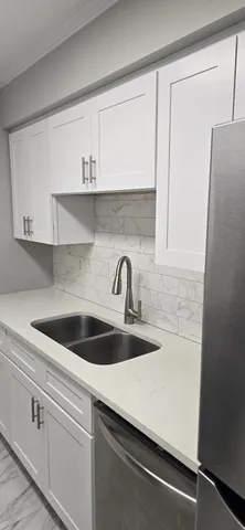 a kitchen with a stove and a microwave