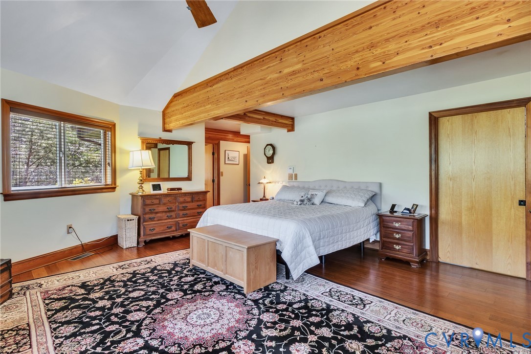 176 Baypointe Court Reedville, VA 22539 - Photo 39 of 60 a bedroom with a bed and wooden floor