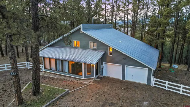 a house that has tree in front of it