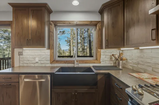 a kitchen with a sink and a window