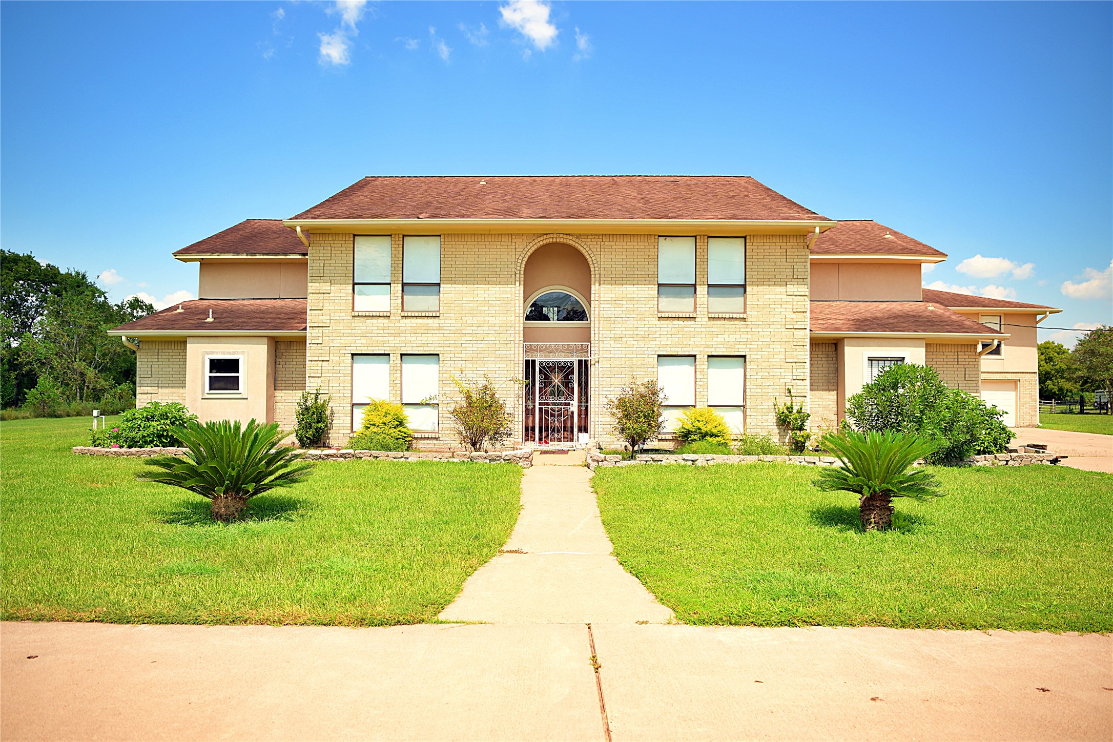 a front view of a house with a yard