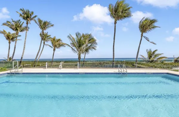 a view of a swimming pool and a table