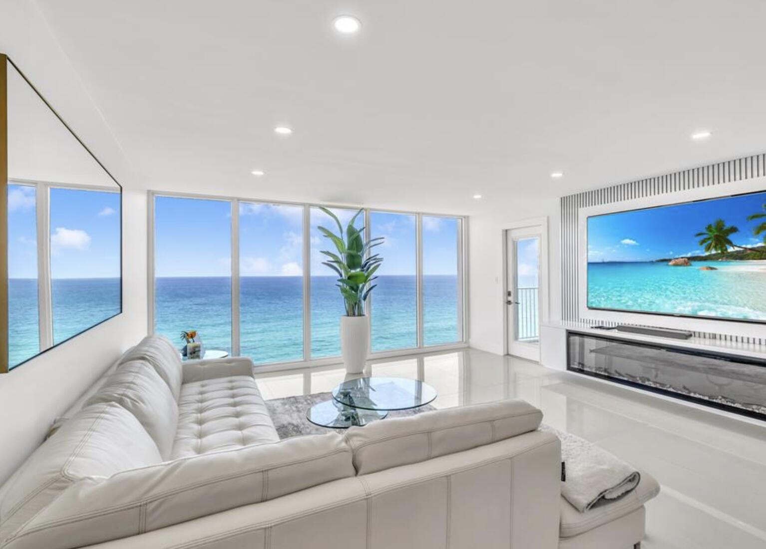 3000 South Ocean Boulevard, Unit 1405 Boca Raton, FL 33432 - Photo 3 of 17 a living room with furniture potted plant and a large window