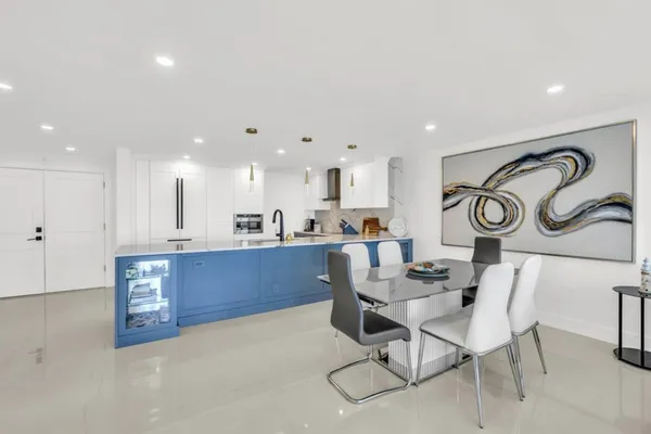 a kitchen with stainless steel appliances granite countertop a sink and cabinets