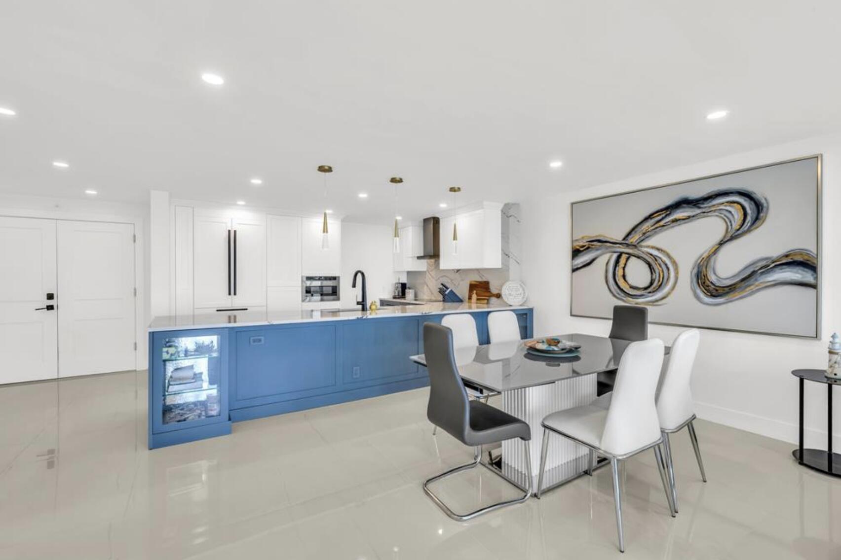 3000 South Ocean Boulevard, Unit 1405 Boca Raton, FL 33432 - Photo 4 of 17 a kitchen with stainless steel appliances granite countertop a sink and cabinets