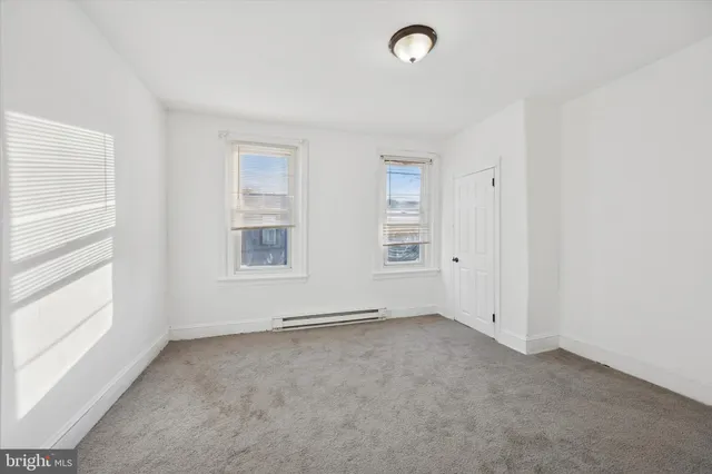 an empty room with windows