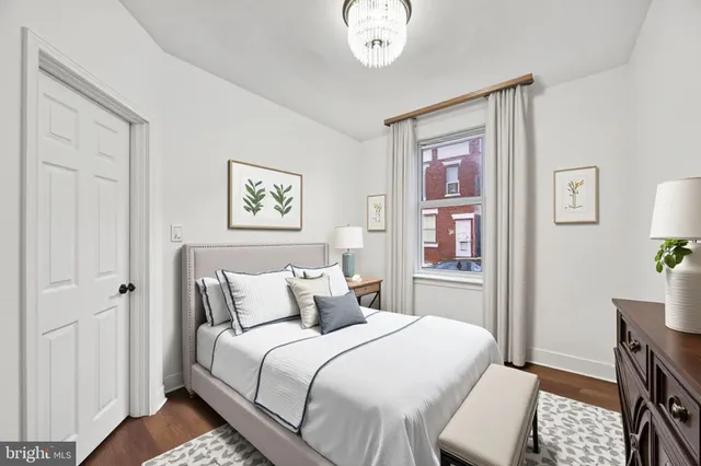 a bedroom with a bed and a view of bedroom