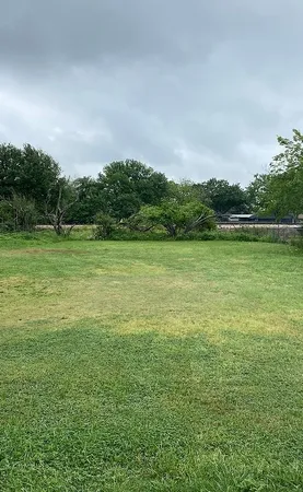 a view of a field with an outdoor space