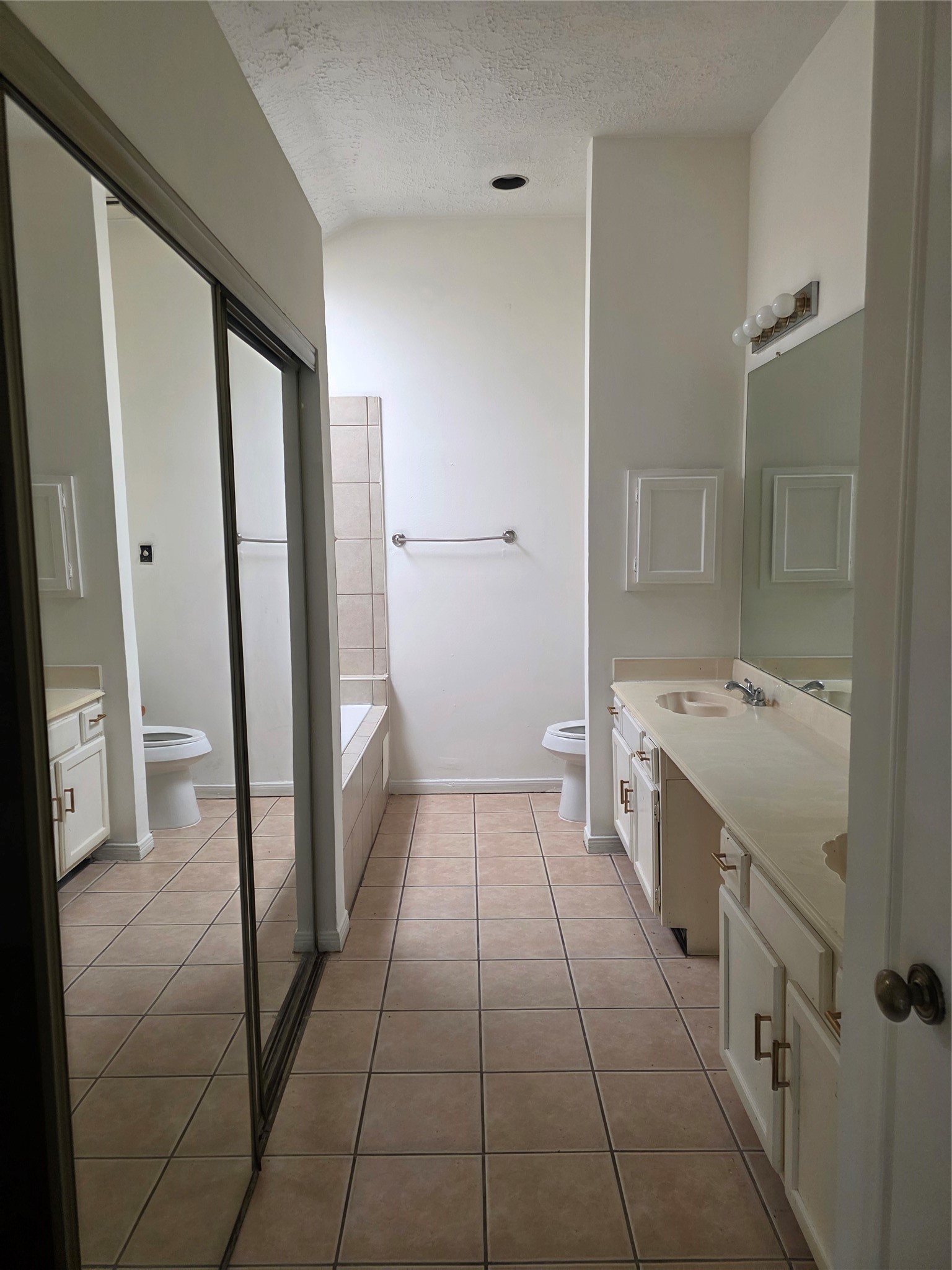 7803 La Rochelle Circle Houston, TX 77071 - Photo 4 of 9 a bathroom with a granite countertop sink a toilet and a shower