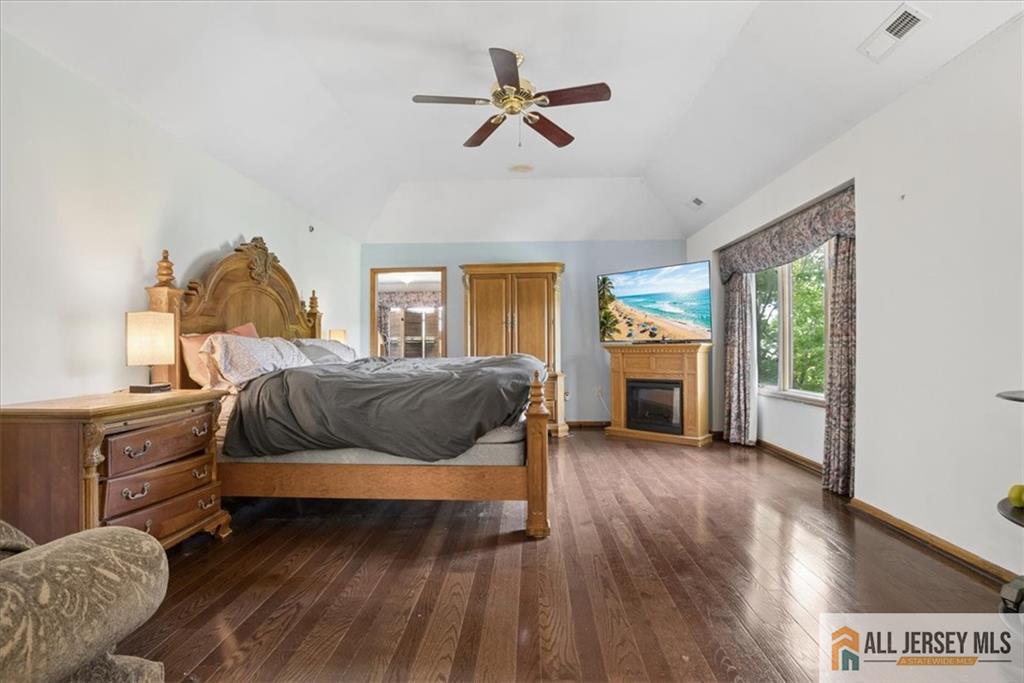167 Federal Road Monroe Township, NJ 08831 - Photo 22 of 46 a bedroom with a bed and wooden floor