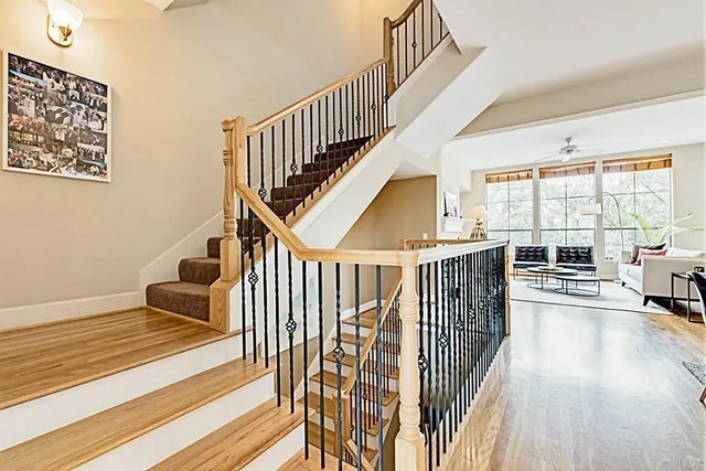 a view of entryway and hall with wooden floor
