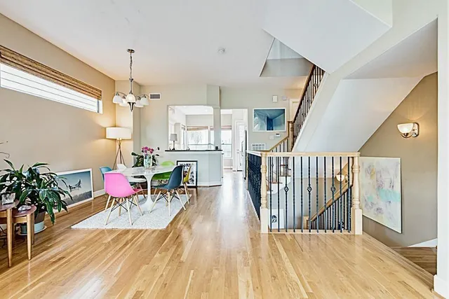 a view of a dining room with furniture window and wooden floor
