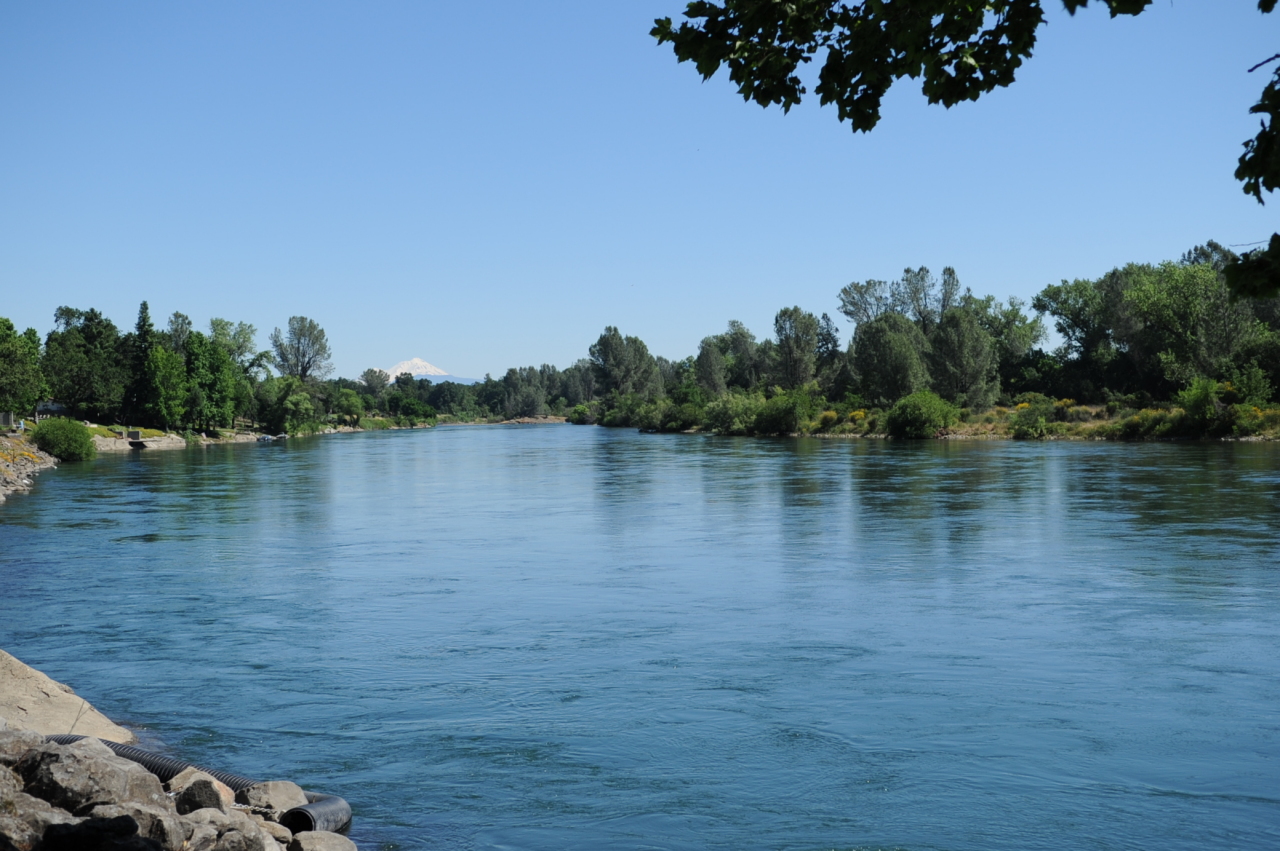 6471 Riverside Drive Redding, CA 96001 - Photo 1 of 56 a view of a lake with houses in background