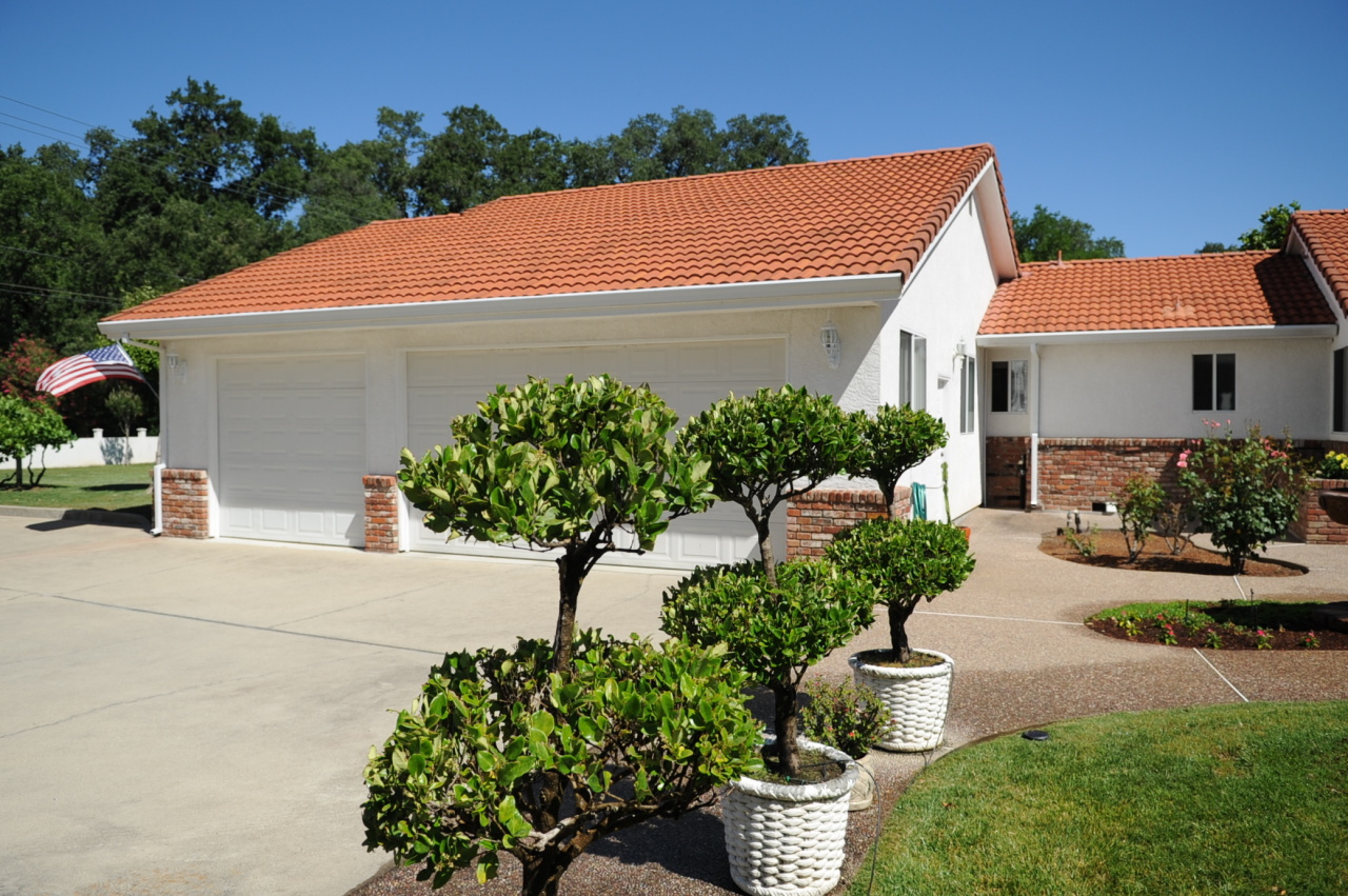 6471 Riverside Drive Redding, CA 96001 - Photo 21 of 56 a front view of a house with garden