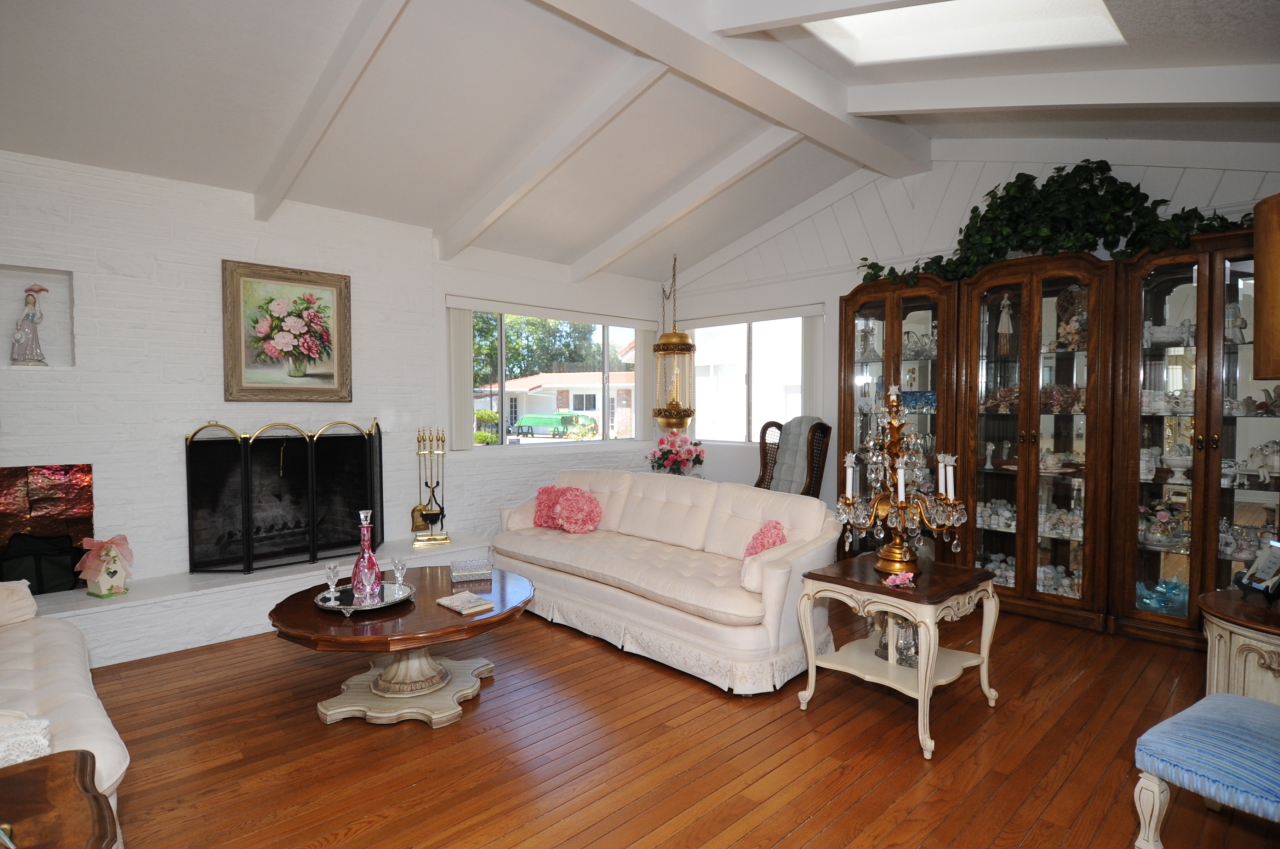 6471 Riverside Drive Redding, CA 96001 - Photo 29 of 56 a living room with furniture window and a fireplace