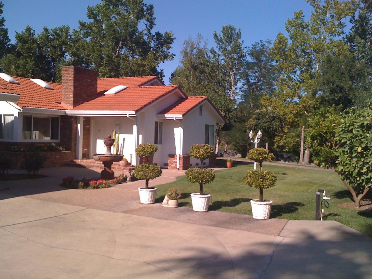 6471 Riverside Drive Redding, CA 96001 - Photo 3 of 56 a view of a house with backyard porch and sitting area